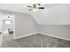 Bedroom featuring a modern ceiling fan, neutral gray walls and carpet at 505 W Washington St, Shelbyville, IN 46176