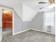 Bedroom features a walk-in closet, ceiling fan, and wall to wall carpet at 505 W Washington St, Shelbyville, IN 46176