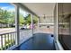 This spacious front porch offers a great view of the tree-lined street and surrounding homes at 505 W Washington St, Shelbyville, IN 46176