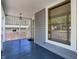 This image highlights the porch's design and spaciousness, framed by a large window and inviting atmosphere at 505 W Washington St, Shelbyville, IN 46176