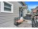 Relaxing porch with wrought-iron chair and a covered entrance, perfect for enjoying the outdoors at 505 W Washington St, Shelbyville, IN 46176