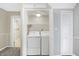 Laundry room includes a washer and dryer at 505 W Washington St, Shelbyville, IN 46176