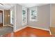 Living room with hardwood floors, natural light from windows, and views to other rooms at 505 W Washington St, Shelbyville, IN 46176