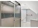 A bright bathroom with a shower and tiled floor are conveniently located at 505 W Washington St, Shelbyville, IN 46176