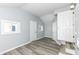 Basement area with gray walls, light ceiling, wood-look flooring, and natural light from above-ground windows at 516 W Washington St, Lebanon, IN 46052
