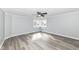 Clean and bright bedroom featuring luxury vinyl plank flooring and a corner window at 516 W Washington St, Lebanon, IN 46052