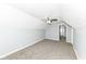 Carpeted bedroom with a ceiling fan and doorway to another room at 516 W Washington St, Lebanon, IN 46052