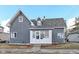 Charming two-story home with gray siding, dormer windows, and landscaped front yard at 516 W Washington St, Lebanon, IN 46052