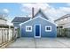 Exterior view of a detached garage with a blue door and concrete driveway at 516 W Washington St, Lebanon, IN 46052