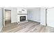 Inviting living room with gray walls, white trim, wood-look flooring, and a fireplace at 516 W Washington St, Lebanon, IN 46052