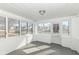 Bright and airy sunroom with white brick walls and multiple windows at 516 W Washington St, Lebanon, IN 46052
