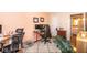 Bright bedroom features a workspace with two monitors, shag carpet and a glimpse of the attached bathroom at 5629 Crittenden Ave, Indianapolis, IN 46220