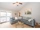 Inviting living room with vaulted ceiling, French doors to the patio and stylish furnishings at 5629 Crittenden Ave, Indianapolis, IN 46220