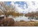 Scenic view of a serene pond with a home visible in the background at 5629 Crittenden Ave, Indianapolis, IN 46220
