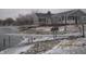 Scenic view of the backyard with a deck, a pier, and lake access at 5820 N Nebo Rd, Muncie, IN 47304