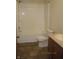 Full bathroom featuring a white tub with shower and toilet near vanity at 5820 N Nebo Rd, Muncie, IN 47304