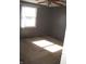 Simple bedroom featuring carpeted floors, a window, and neutral wall paint at 5820 N Nebo Rd, Muncie, IN 47304