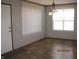 Bright dining area with vinyl floors, natural light, and simple elegant finishes at 5820 N Nebo Rd, Muncie, IN 47304