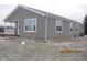 Charming one-story home with gray siding, white trim, and a covered front porch at 5820 N Nebo Rd, Muncie, IN 47304
