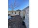 The backyard has overgrown vegetation and a shed at 6944 E 300 S, Greenfield, IN 46140