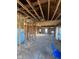 Spacious interior showcasing exposed beams and open-concept design, awaiting personalization at 6944 E 300 S, Greenfield, IN 46140