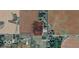 Aerial view of potential land to develop on surrounded by mature trees and accessible paved roads at 6944 E 300 S, Greenfield, IN 46140
