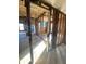 Sunlit living room showcasing exposed beams and framing, creating a unique, customizable space at 6944 E 300 S, Greenfield, IN 46140