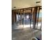 Open-concept living room with natural light streaming through windows highlighting the potential for renovation at 6944 E 300 S, Greenfield, IN 46140