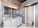 Primary bath with double sink vanity, large mirror and modern fixtures at 735 Lexington Ave # 30, Indianapolis, IN 46203