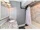Bathroom with a marble countertop, tiled shower, and a tub with shower curtain at 735 Lexington Ave # 30, Indianapolis, IN 46203