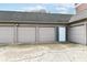 Long shot of multiple car garages at a condominium with door to exterior at 735 Lexington Ave # 30, Indianapolis, IN 46203