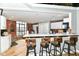 Kitchen featuring a breakfast bar with seating, stainless steel appliances, and white cabinets at 735 Lexington Ave # 30, Indianapolis, IN 46203