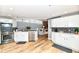 Bright kitchen featuring stainless steel appliances, stone countertops, and white cabinets at 735 Lexington Ave # 30, Indianapolis, IN 46203