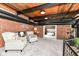 Living room with brick walls and exposed ducts at 735 Lexington Ave # 30, Indianapolis, IN 46203