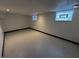Spacious basement with concrete floor and glass block windows at 744 Wallace Ave, Indianapolis, IN 46201
