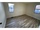 The bedroom boasts stylish floors, and sun-filled windows at 744 Wallace Ave, Indianapolis, IN 46201