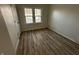 Cozy bedroom with lots of sunlight and sleek hardwood floors at 744 Wallace Ave, Indianapolis, IN 46201