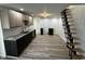 Modern kitchen with gray granite counters, light wood cabinets, and modern appliances at 744 Wallace Ave, Indianapolis, IN 46201
