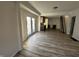 Sunlit living space with chic floors, and modern kitchen access at 744 Wallace Ave, Indianapolis, IN 46201