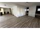 Open-concept layout showcases sleek floors seamlessly connecting the living area to the kitchen at 744 Wallace Ave, Indianapolis, IN 46201