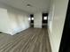 Bright living room featuring sleek floors and fresh paint at 744 Wallace Ave, Indianapolis, IN 46201