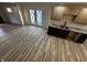 Open floor plan living room featuring modern finishings and hardwood floors at 744 Wallace Ave, Indianapolis, IN 46201