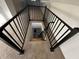 Modern stairwell with dark railing and carpeted steps at 744 Wallace Ave, Indianapolis, IN 46201