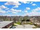 Scenic aerial view of a cityscape with lush greenery, visible parking, and cloudy blue skies on the horizon at 76 E Wayne St # B, Franklin, IN 46131