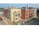 Street-level view of new condominiums, highlighting mixed brick and siding exteriors with visible construction and landscaping at 76 E Wayne St # B, Franklin, IN 46131