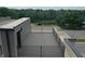 A rooftop deck features composite decking and metal railings, providing an outdoor extension to the building and relaxing space at 76 E Wayne St # B, Franklin, IN 46131