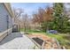 Landscaped backyard with a rock pathway, grassy area and natural views in a fully fenced yard at 8015 Sargent Rdg, Indianapolis, IN 46256
