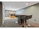 Entertaining basement with bar area, seating, and neutral color scheme at 8015 Sargent Rdg, Indianapolis, IN 46256