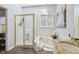 Bright bathroom features a glass-enclosed shower, soaking tub, granite countertops, and a window at 8015 Sargent Rdg, Indianapolis, IN 46256