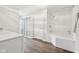 Bright bathroom with walk-in shower, soaking tub, and plenty of storage in this modern-styled space at 8015 Sargent Rdg, Indianapolis, IN 46256